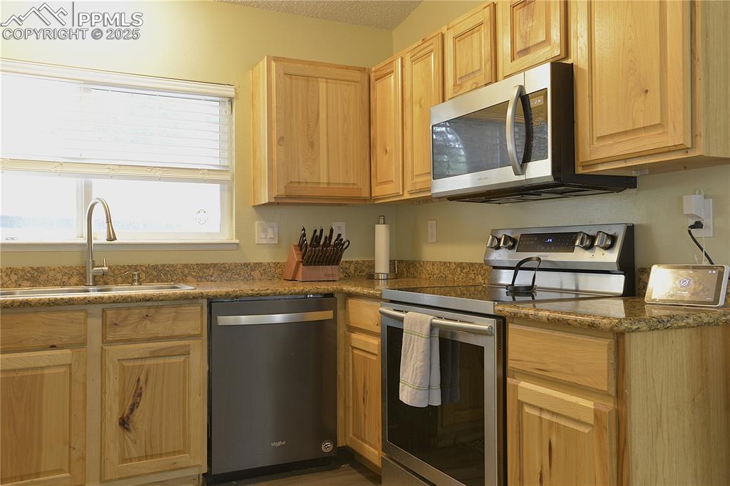 Image 12 of 29: Kitchen with upgraded appliances and cabinets