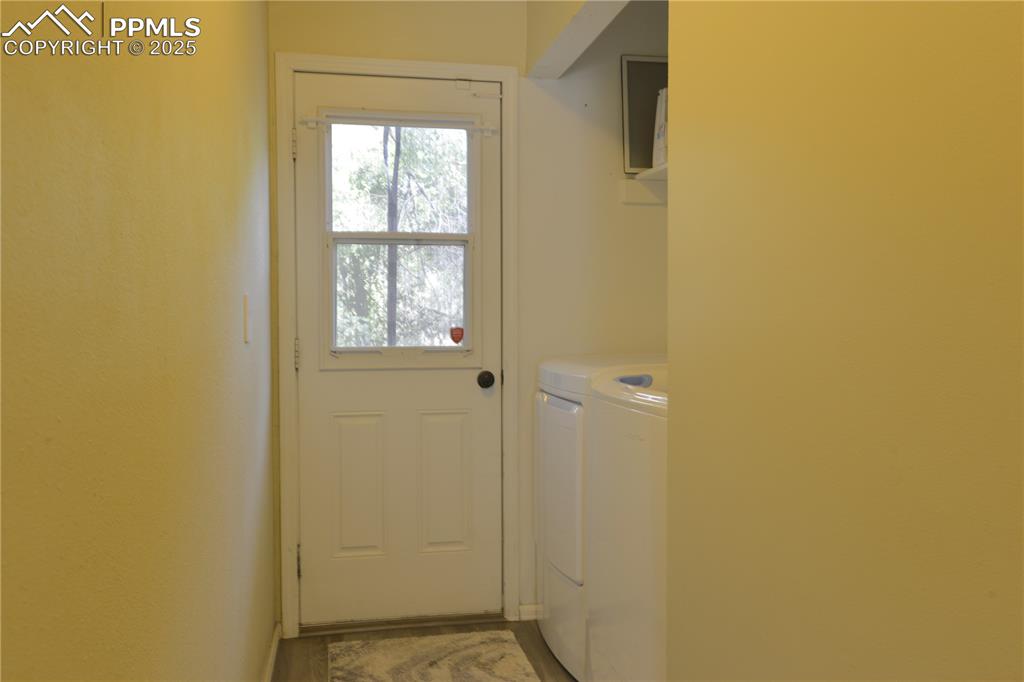 Image 14 of 29: Laundry Area Adjacent to Back Door and Deck Access