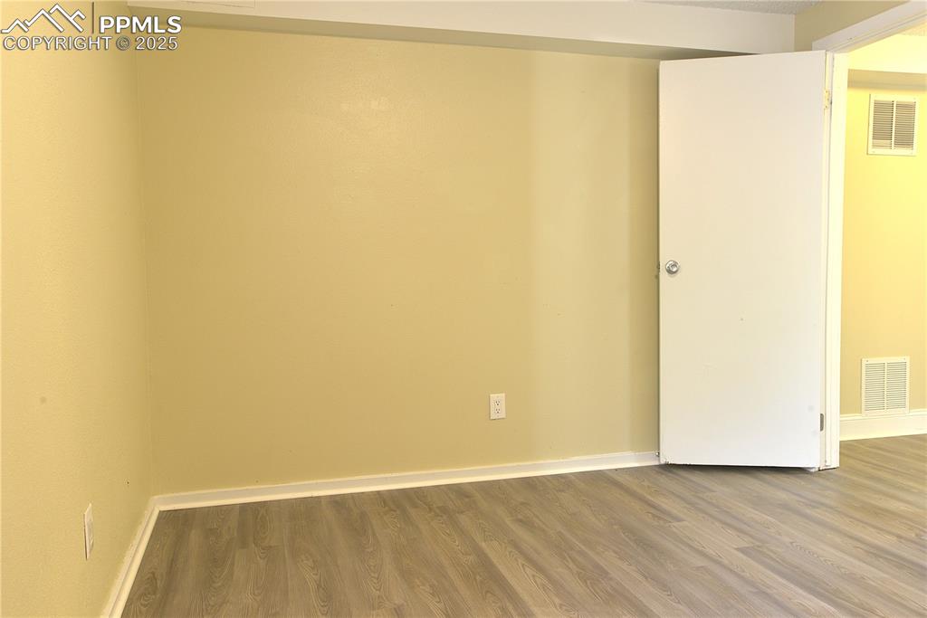Image 25 of 29: 2nd Basement Level Bedroom with Large Closets and Light Filled Window