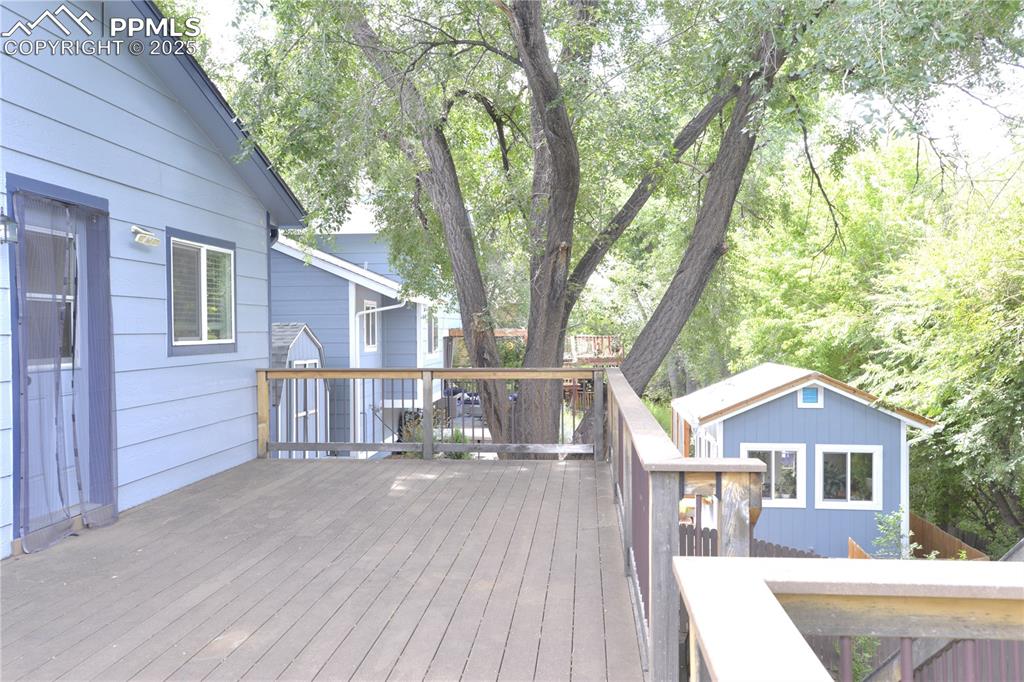 Image 28 of 29: Wooden deck perfect for entertaining