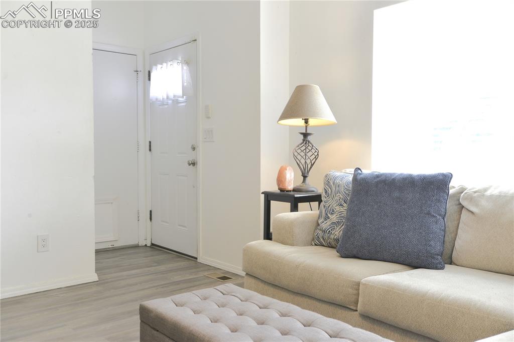 Image 3 of 29: Living room featuring plenty of natural light and vaulted ceilings