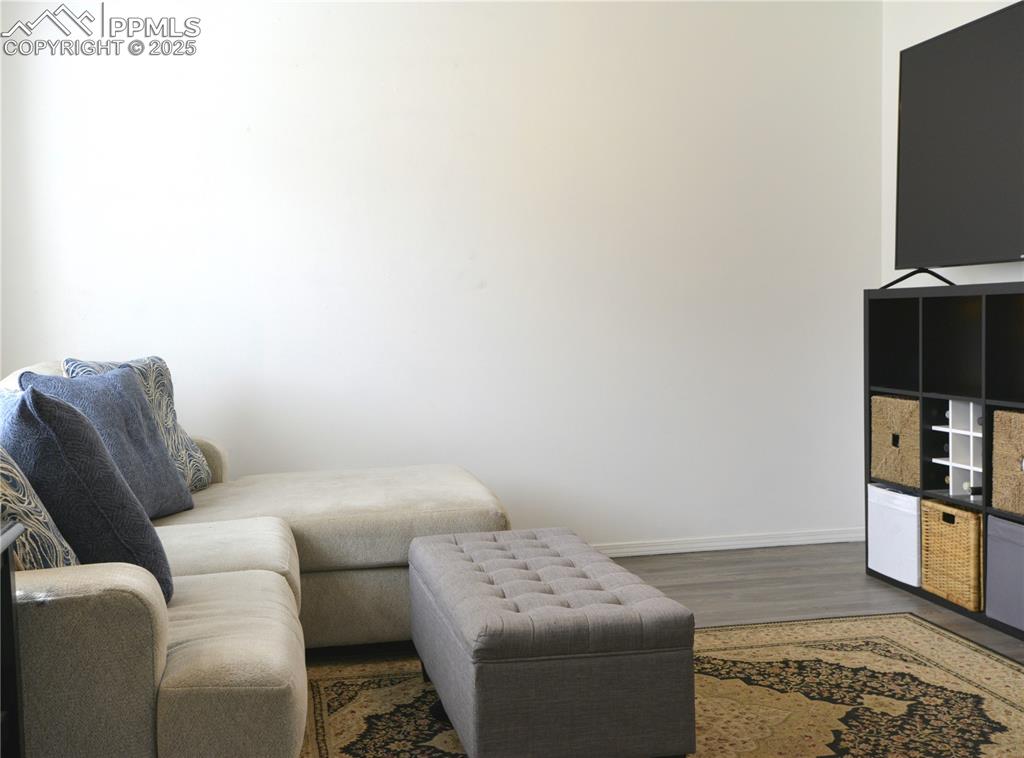 Image 6 of 29: Living room featuring plenty of natural light and vaulted ceilings