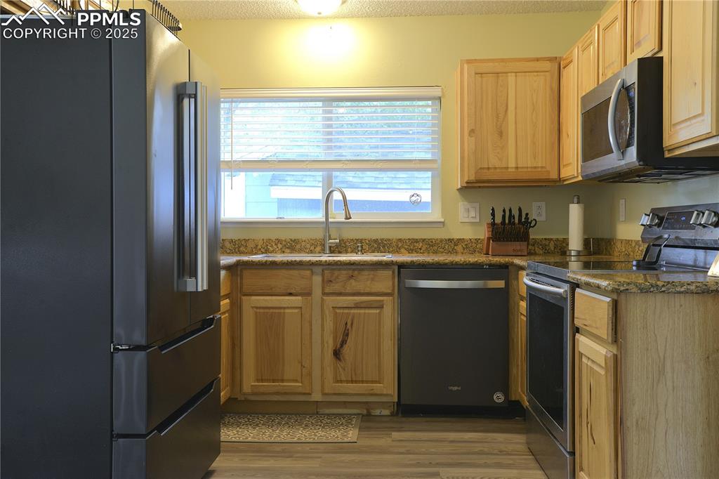 Image 9 of 29: Kitchen featuring upgraded cabinets and stainless appliances