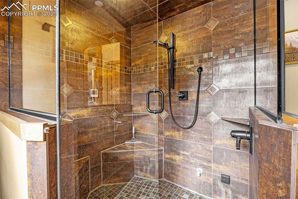 Image 15 of 45: Bathroom featuring a shower stall