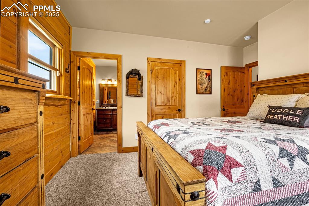 Image 17 of 45: Bedroom featuring light colored carpet