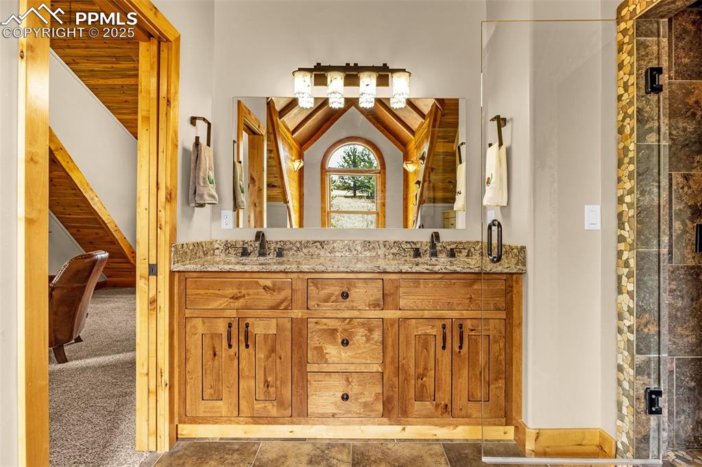 Image 28 of 45: Full bathroom featuring double vanity