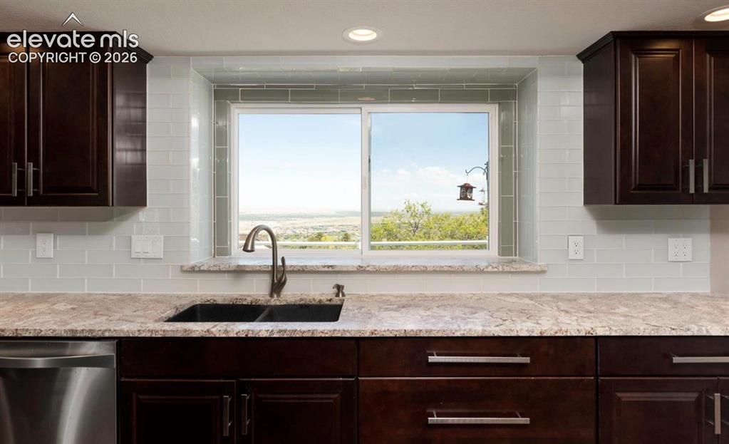Image 10 of 45: View of the city from the kitchen sink area!
