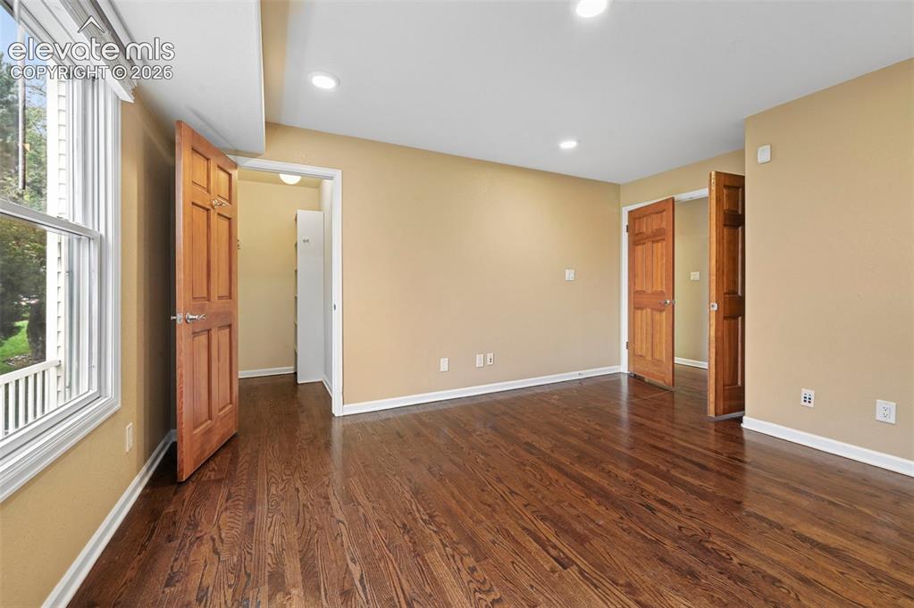 Image 14 of 45: Office tucked behind classic double doors, could also serve as main level b