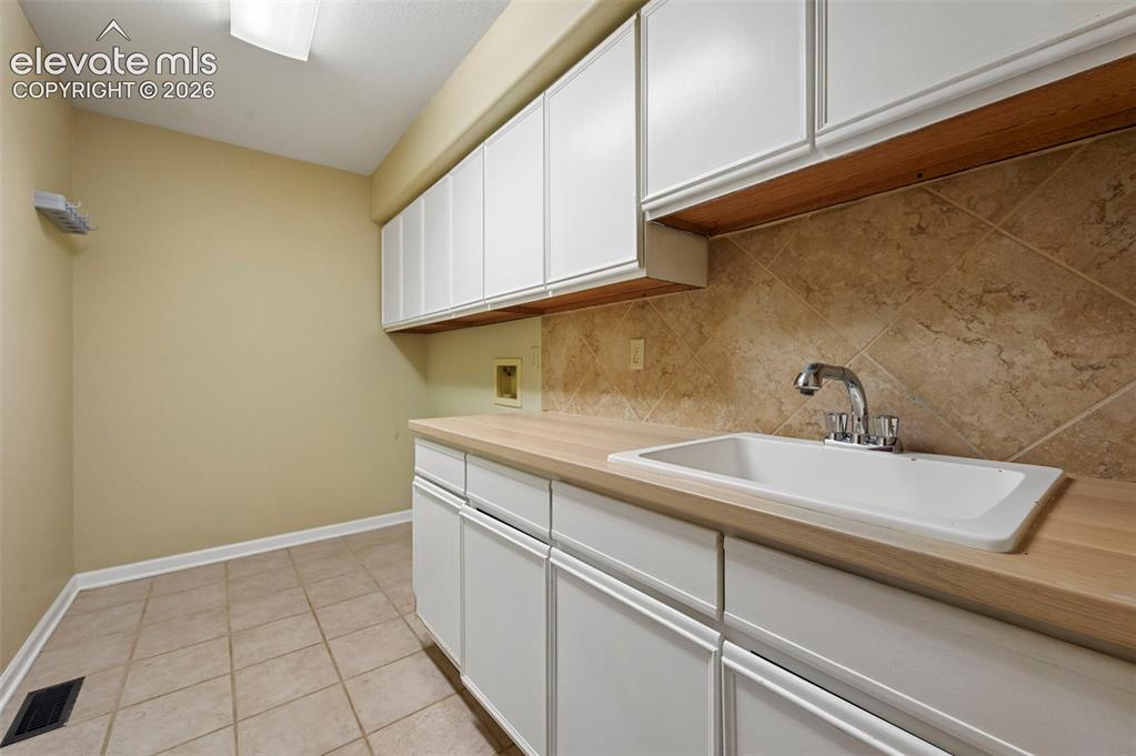 Image 16 of 45: Main level laundry