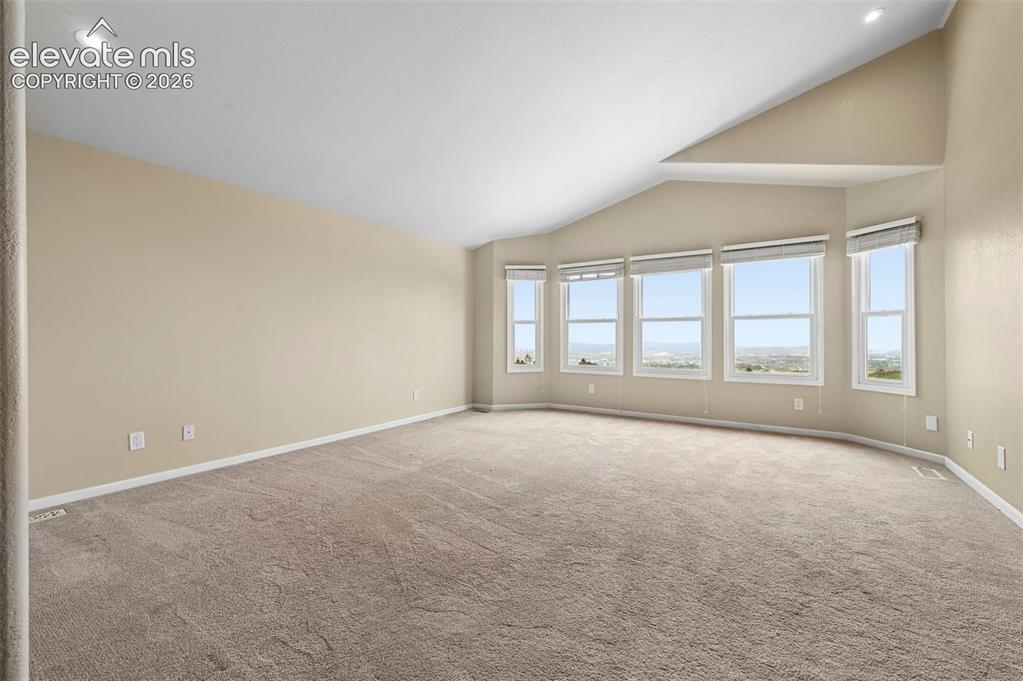 Image 18 of 45: primary bedroom overlooking the city!