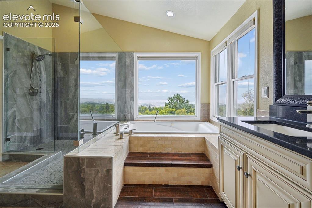 Image 21 of 45: Designer primary bathroom with jet tub that overlooks the city!!!!