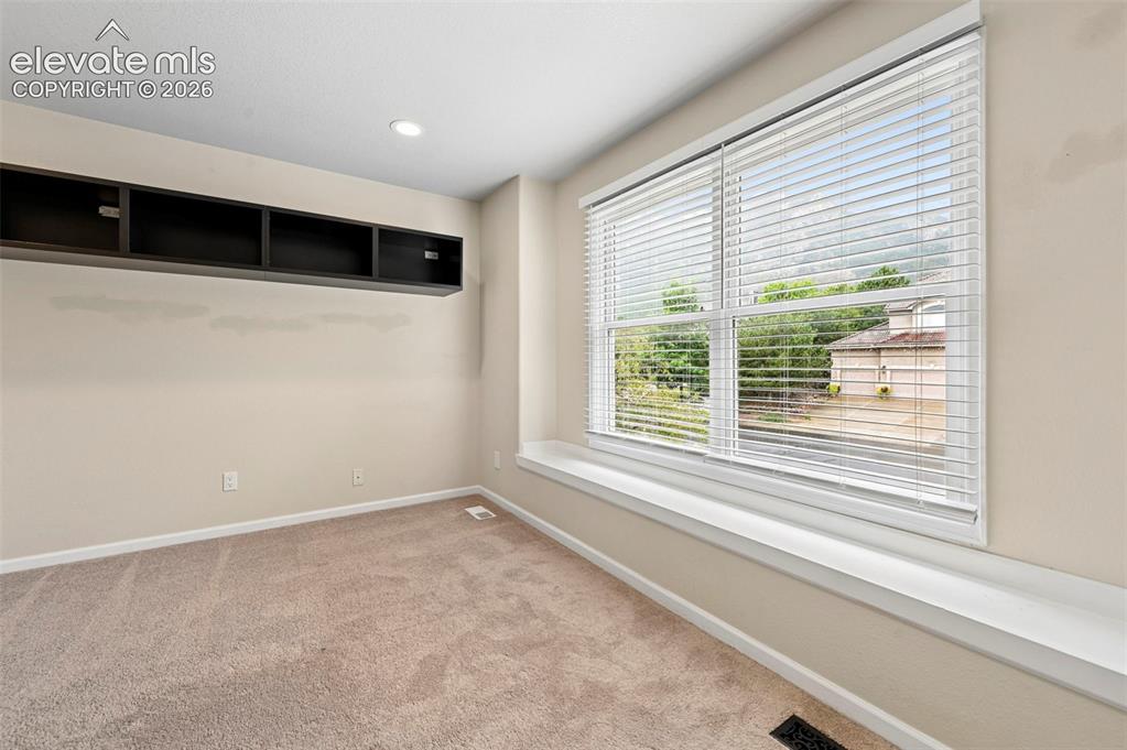 Image 31 of 45: Upstairs bedroom with incredible views of Cheyanne mountain 