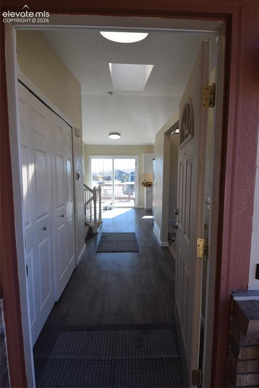 Image 10 of 44: Entryway featuring wood-finish flooring and a skylight