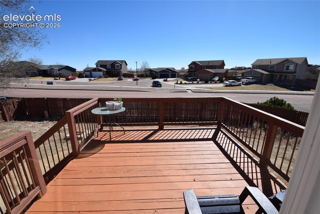 Image 3 of 44: Expansive wood deck with a full railing system