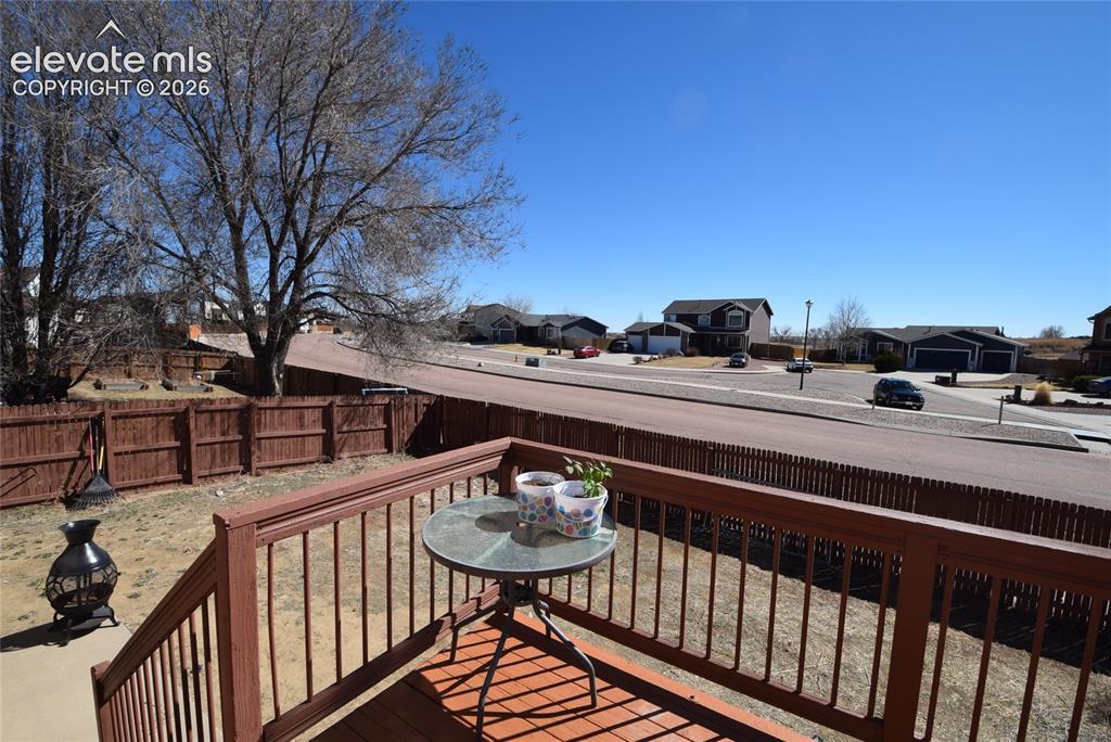 Image 44 of 44: Wood-finish deck with a matching railing system