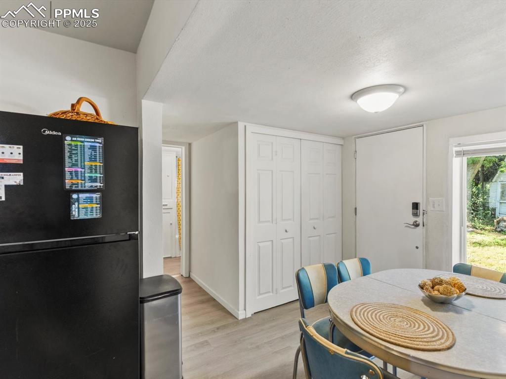 Image 18 of 25: Laundry behind bifold doors