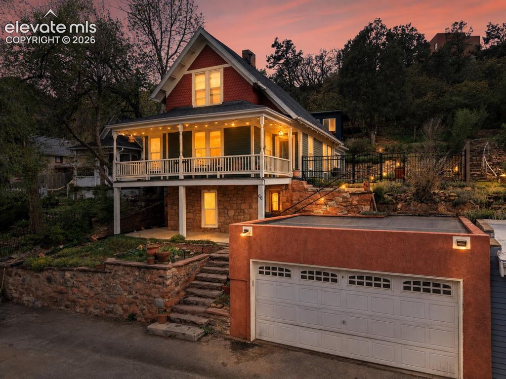 Image 1 of 50: Front of structure featuring detached garage