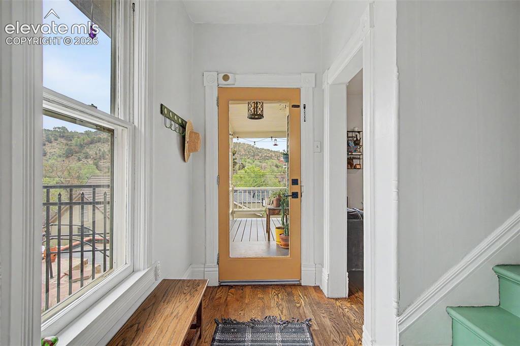 Image 13 of 50: Entry way featuring hardwood flooring and windowed front door