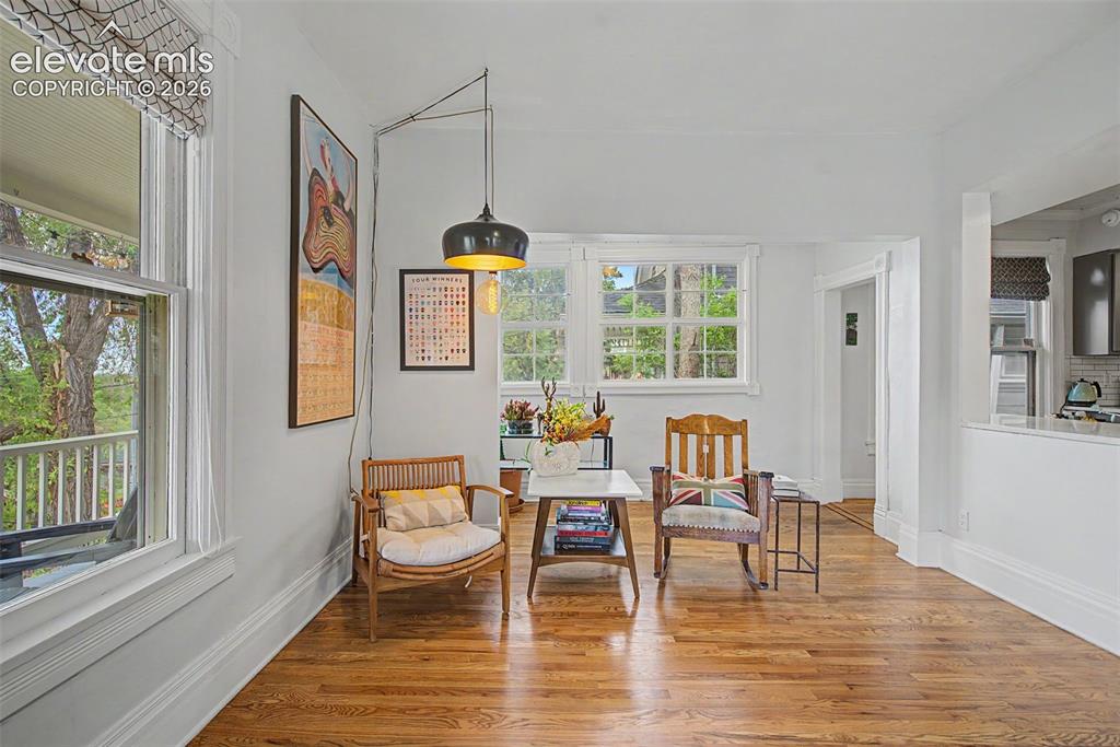 Image 14 of 50: Living room featuring hardwood flooring and bright natural light