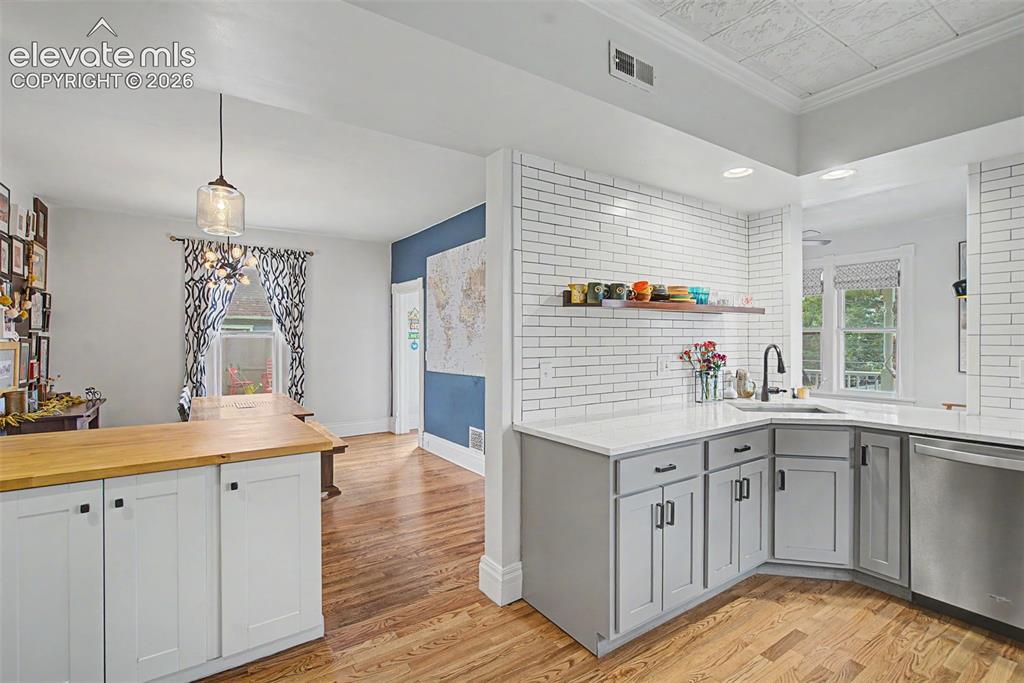 Image 23 of 50: Kitchen to dining room open floor concept emphasizing an open and inviting