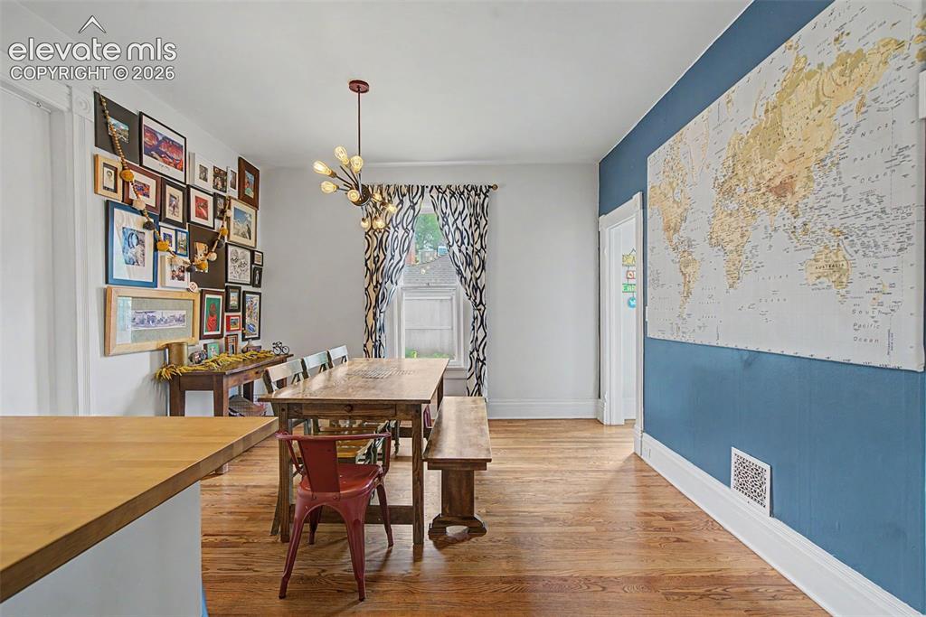 Image 26 of 50: Dining area featuring hardwood flooring