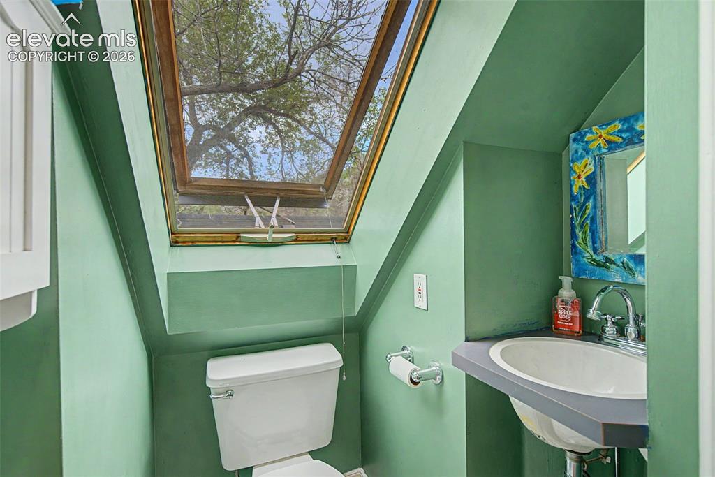 Image 35 of 50: Upper level 1/2 bath room
