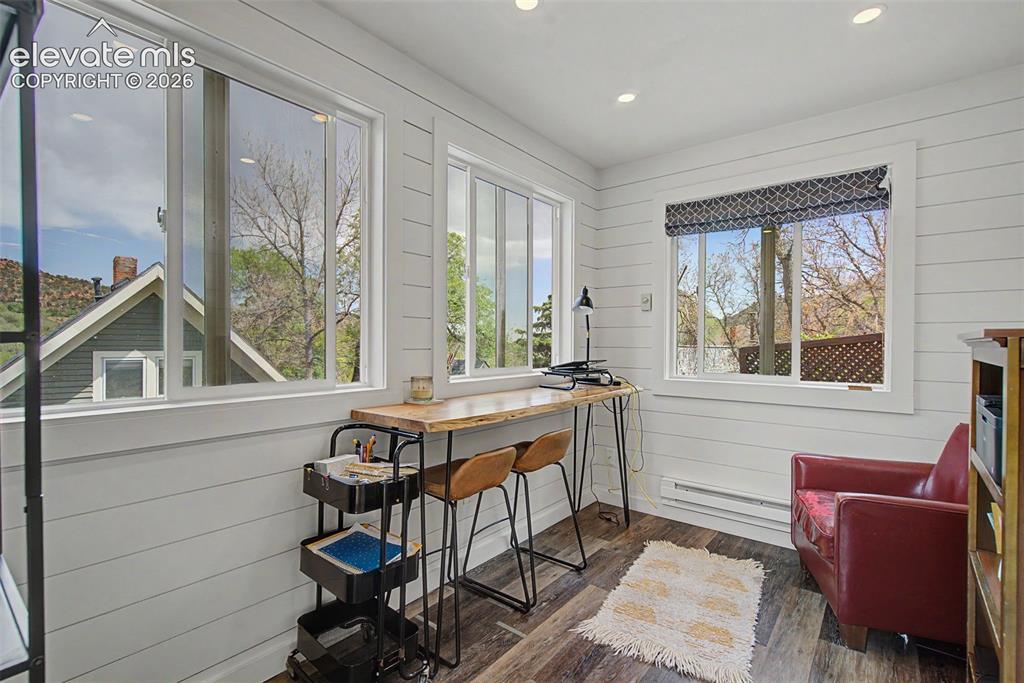 Image 47 of 50: Creative studio in backyard with electricity and baseboard heating.