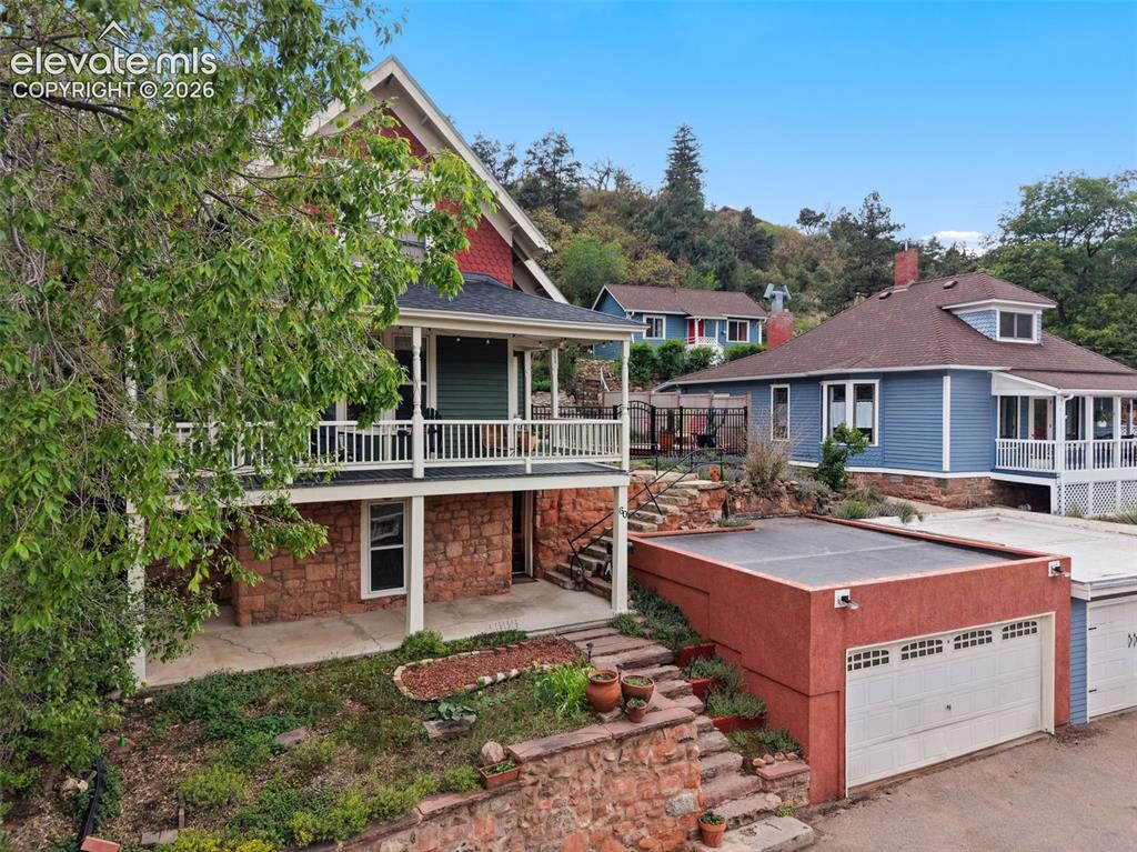 Image 8 of 50: Front of structure featuring detached garage