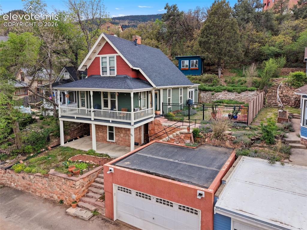 Image 9 of 50: Front of structure featuring detached garage