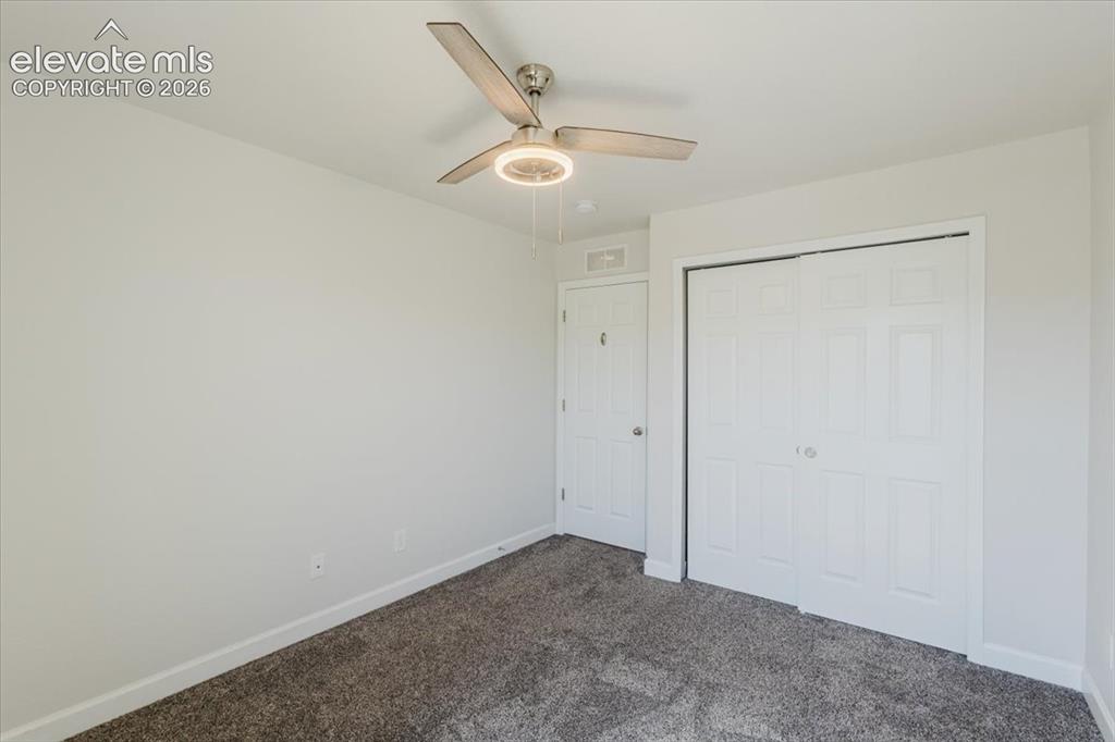 Image 28 of 50: Room featuring neutral carpeting, white baseboards, and a contemporary ceil