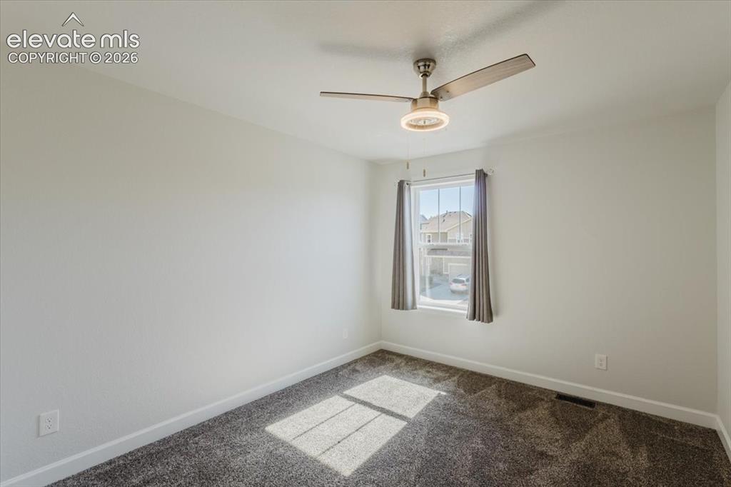 Image 29 of 50: Neutral-toned carpeting complements light-colored walls in this room