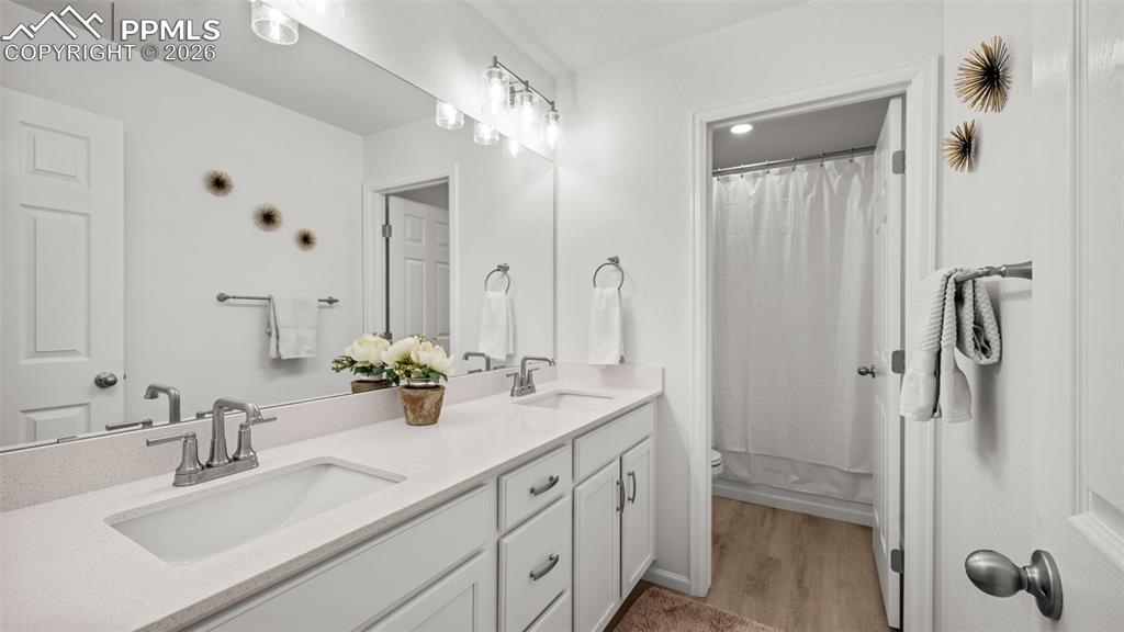 Image 25 of 46: Full Bathroom upstairs with double vanities