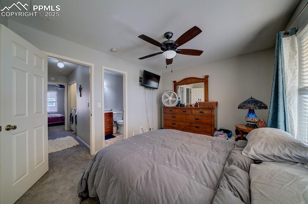 Image 23 of 37: Primary Bedroom with view into the Primary Bathroom.