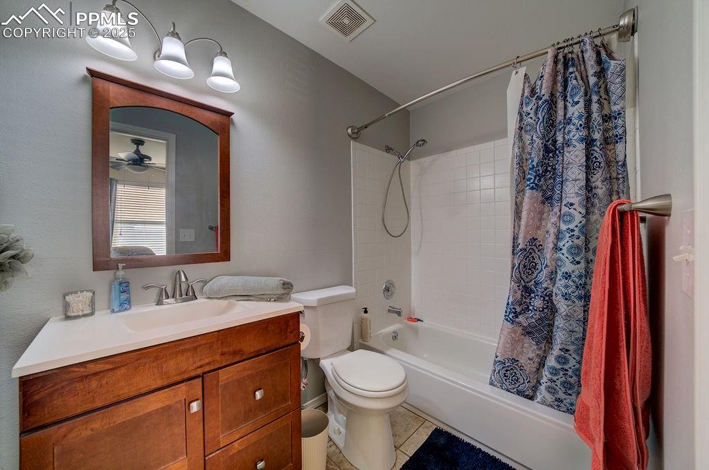 Image 26 of 37: The Primary Bathroom offers a vanity, framed mirror, and tub/shower.