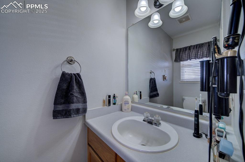 Image 6 of 37: Convenient Powder Bathroom off the Entry