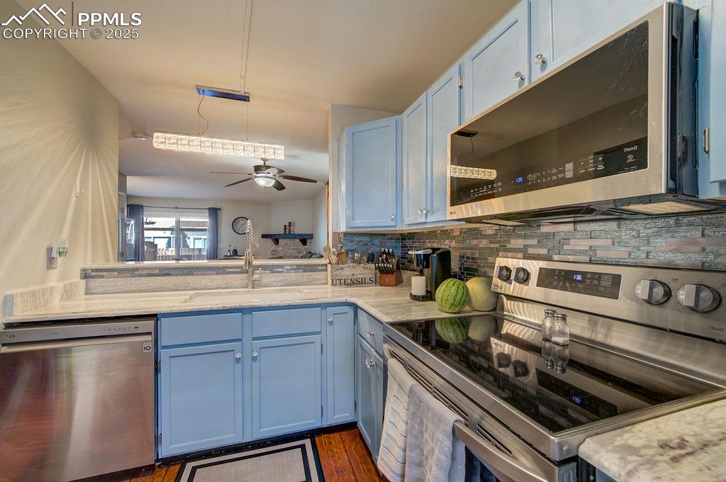 Image 9 of 37: Smooth top range oven and built-in microwave oven.