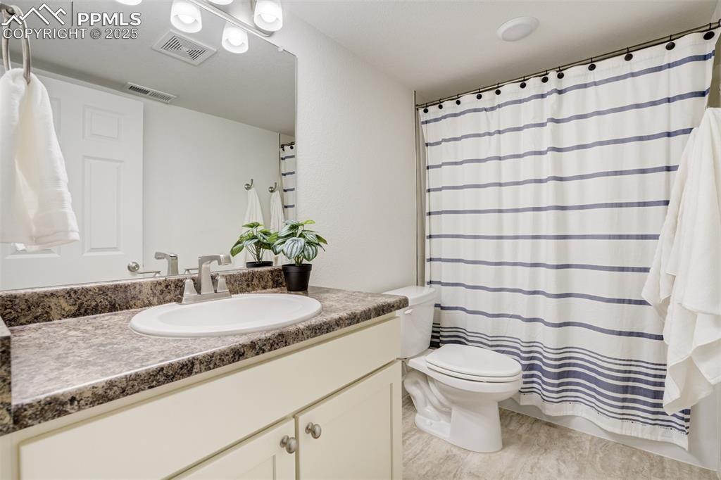 Image 38 of 46: Full bathroom in the basement.