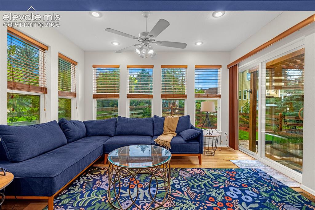 Image 16 of 50: Recessed lighting, wood-finish flooring, multiple windows with blinds, ceil