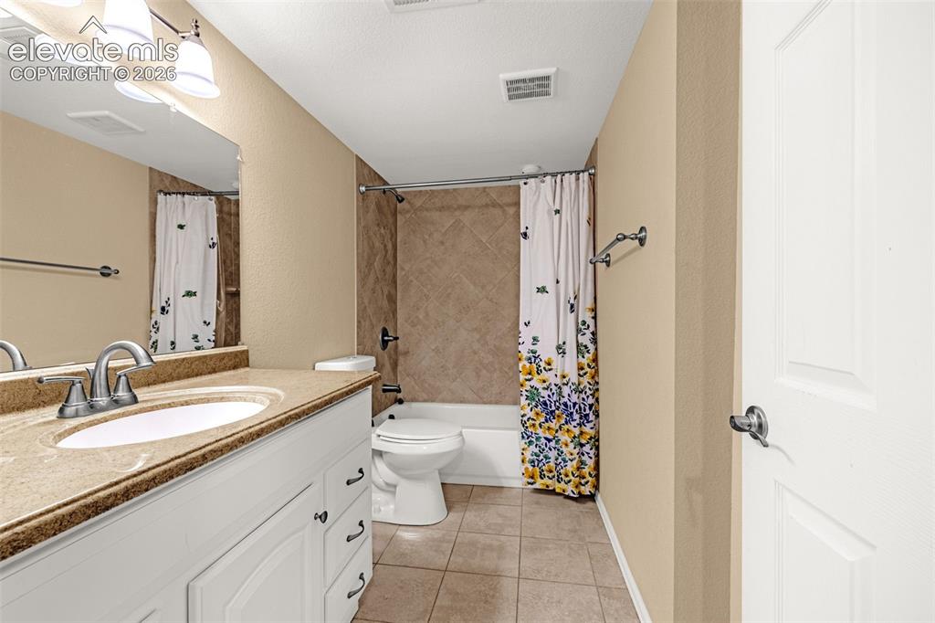 Image 32 of 50: Vanity with integrated sink, brushed nickel faucet, and a large mirror