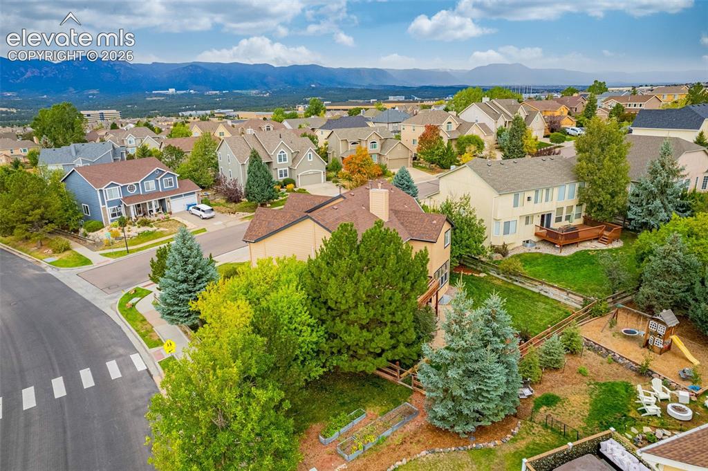 Image 44 of 50: Expansive suburban neighborhood with mountain backdrop