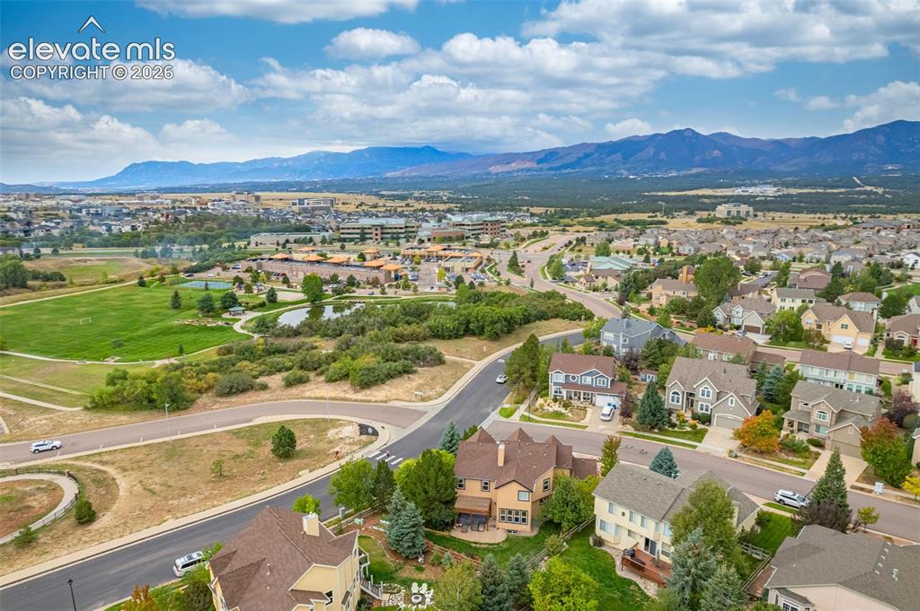 Image 46 of 50: Expansive residential area with diverse architectural styles, surrounded by