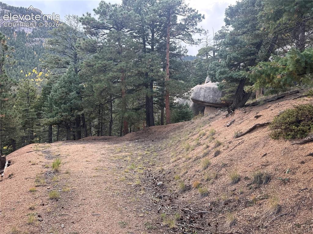 Image 10 of 21: Build site with saucer rock behind
