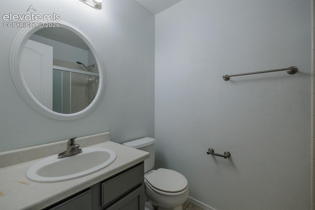 Image 22 of 36: Recessed oval mirror, single vanity with integrated sink, modern brushed ni