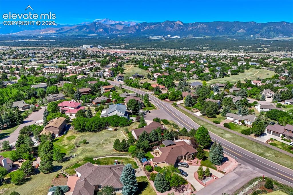Image 44 of 45: Expansive suburban landscape featuring varied architectural styles and matu