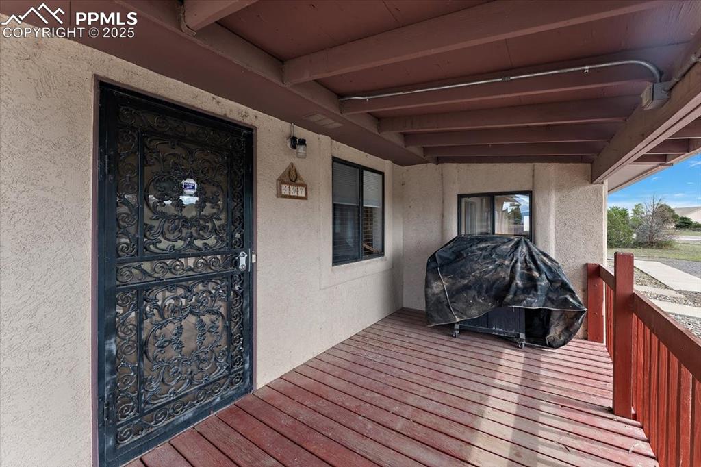 Image 35 of 44: Wooden terrace featuring area for grilling