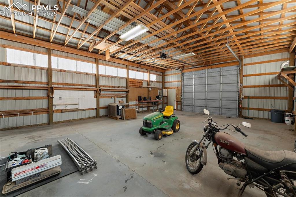 Image 42 of 44: Garage with metal wall