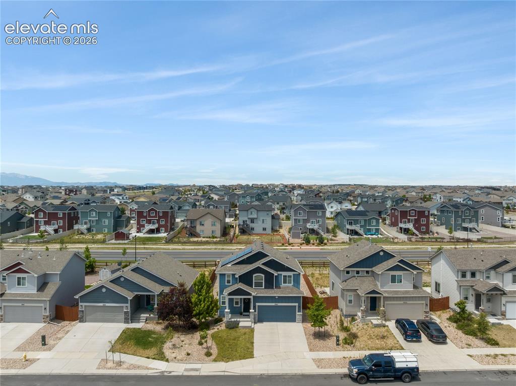 Image 40 of 50: Aerial perspective showcasing a residential community with varied architect