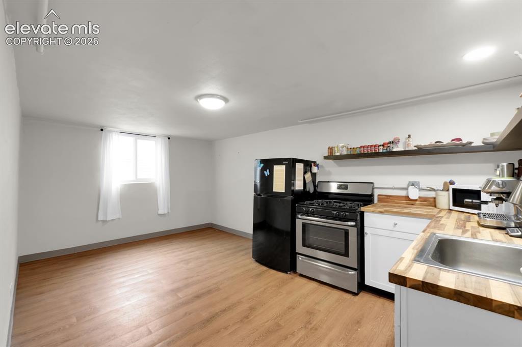 Image 14 of 23: Basement level kitchen