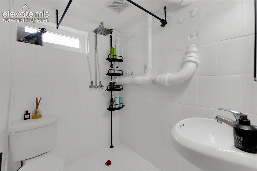 Image 17 of 23: Basement Level bath