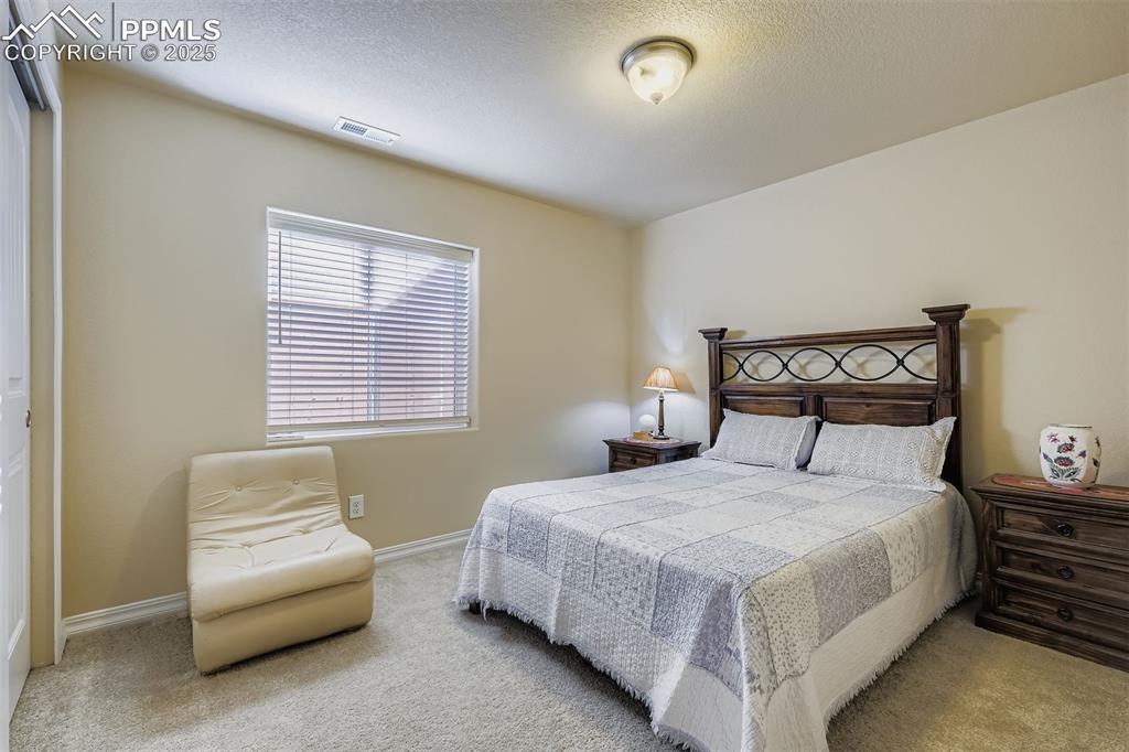 Image 22 of 32: Basement Bedroom